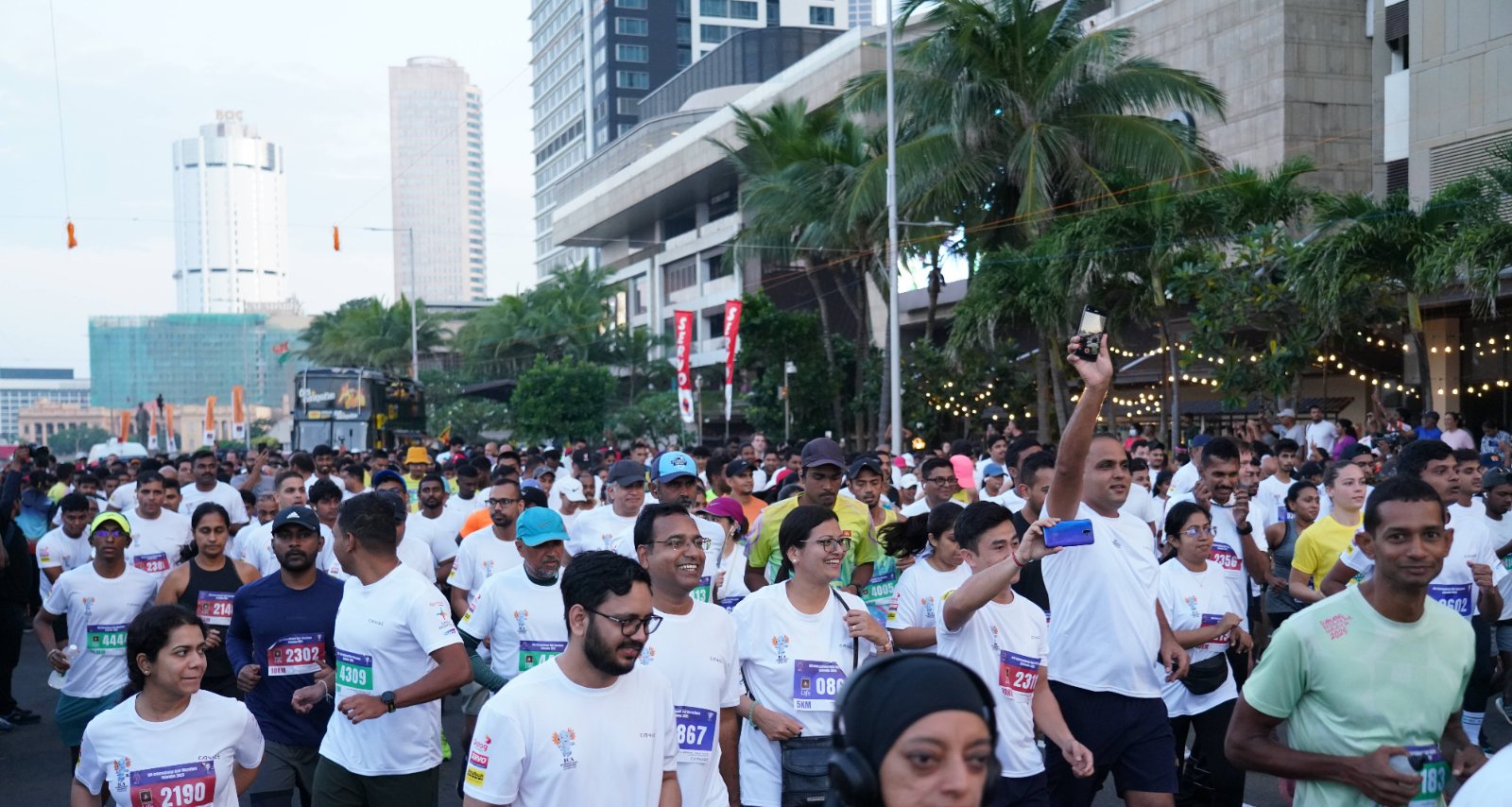 Runners at the start line on Galle Face Green before sunrise, 2025